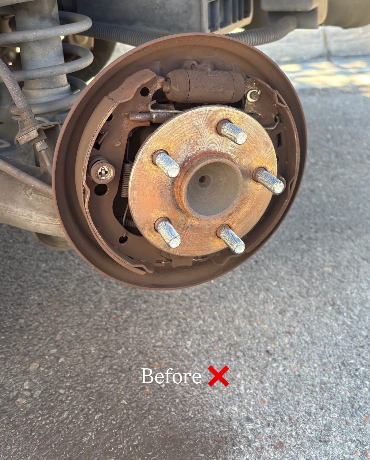 Worn rear drum brake before service