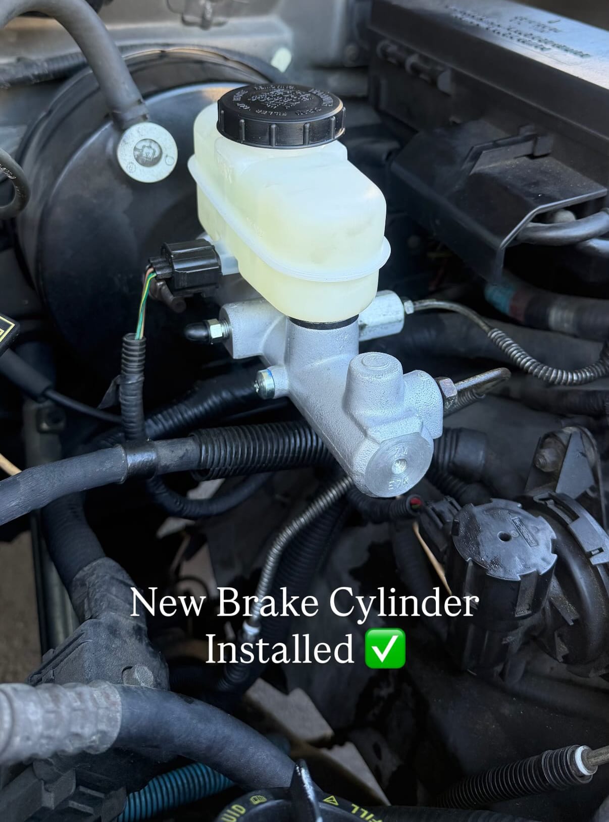 New brake master cylinder installed in engine bay